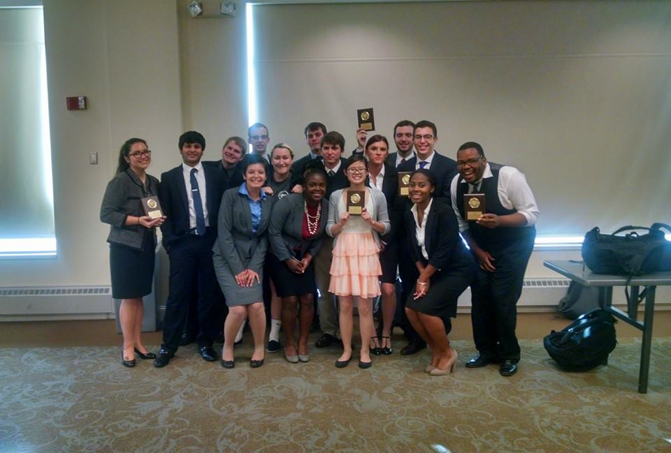 Students pose with awards from Mock Trial tournament