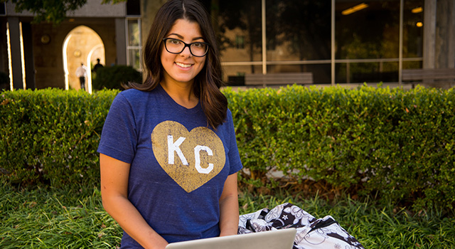 Student on campus in KC shirt