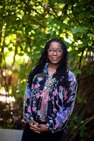 Tiya Miles in front of trees