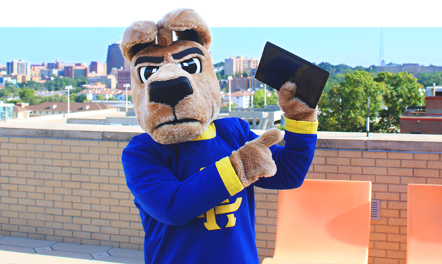photo of Kasey Roo mascot holding up a tablet